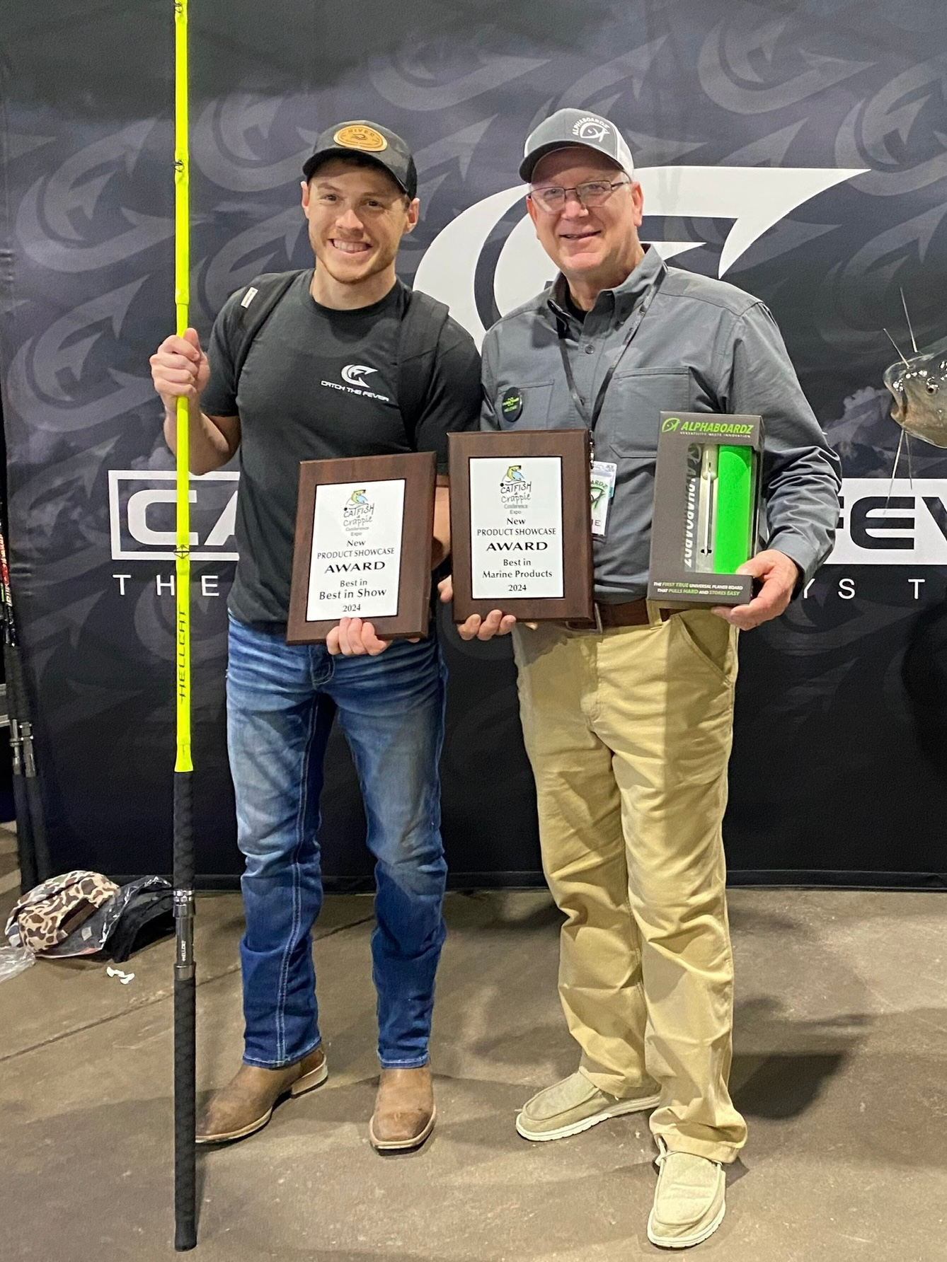 Jamie Harris, co-founder of Alphaboardz, with his brother David, standing together with their awards after winning the Best in Marine Product award at the 2024 Catfish and Crappie Expo in Louisville, KY.