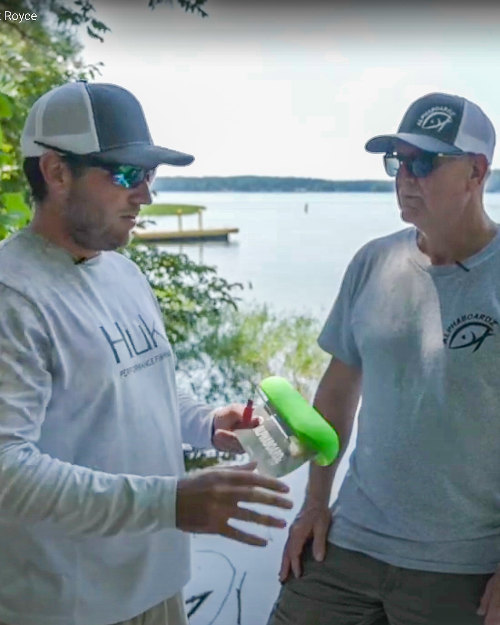 Two anglers discussing Alphaboardz planer boards.